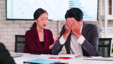 Team leader is blaming the team about the mistakes of the assigned tasks.の写真素材