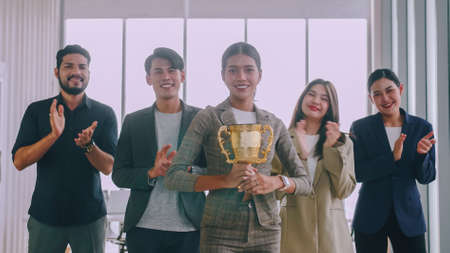 Group of business people are proud to receive an award for a successful project.の写真素材