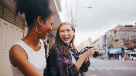 Two girlfriends are enjoying a walk in the city.の写真素材