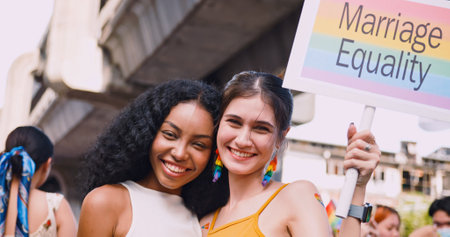 A lesbian couple representing the symbol of homosexuality in a pride parade.の写真素材