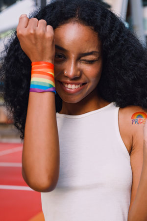 A young black woman shows off her homosexual identity in a pride parade.の写真素材