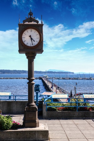 The Centennial Clock in White Rock, British Columbia, overlooks the famous 1,500 ft  long pier that attracts locals and tourists alike の写真素材