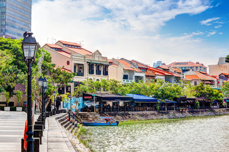Colorful bars and restaurants dot the Singapore River along Boat Quay. The area used to be a commercial center during the colonial era where warehouses are located. Now, it is converted into a popular meeting place for locals and tourists alike. HDR rendeのeditorial素材