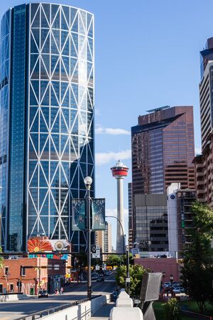 Caglary, Canada - June 21, 2015: Downtown Calgary with its iconic Calgary Tower and The Bow, as viewed from the Centre Street Bridge in Chinatown. At 774 ft, The Bow is the tallest office building in Canada outside of Toronto.のeditorial素材