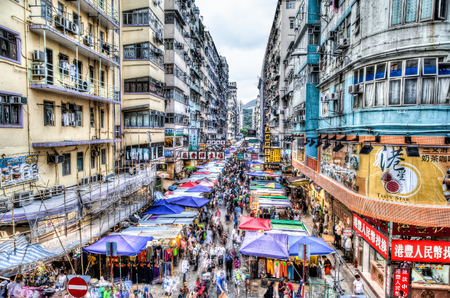 The busy Fa Yuen street market in Hong Kong. The area is popular with tourists and locals for its cheap food and fashion clothing. HDR rendering with long exposure to create crowd motion effect.のeditorial素材