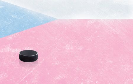 Czech Republic flag embedded on ice hockey rink surface with puck. Low angle view and copy space.の写真素材