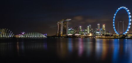 A panorama of Singapore's skyline at night on the Marina Bay.のeditorial素材