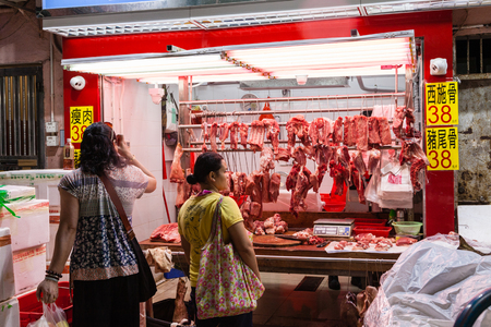 HONG KONG, JULY 6, 2017: A butcher shop at a street market in Hong Kong's old residential district of Quarry Bay.のeditorial素材