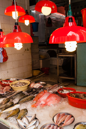 HONG KONG, JULY 5, 2017: A store selling seafood at a street market in Hong Kong's old residential district of Quarry Bay.のeditorial素材
