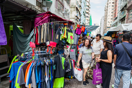 HONG KONG - July 7, 2017: Fok Wing Street, or Toy Street, in Sham Shui Po is a popular street market where visitors go to shop for cheap fashionable clothing, toys and local street foods.のeditorial素材