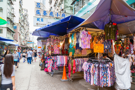 HONG KONG - July 7, 2017: Fok Wing Street, or Toy Street, in Sham Shui Po is a popular street market where visitors go to shop for cheap fashionable clothing, toys and local street foods.のeditorial素材