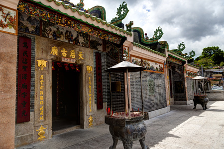 HONG KONG - JULY 14, 2017: Tin Hau temple in Sai Kung, built around 1910s-1920s, was designated as a historic building worthy of preservation by the Hong Kong government. Tin Hau is the Chinese goddess of the sea and features prominently in this seaside vのeditorial素材