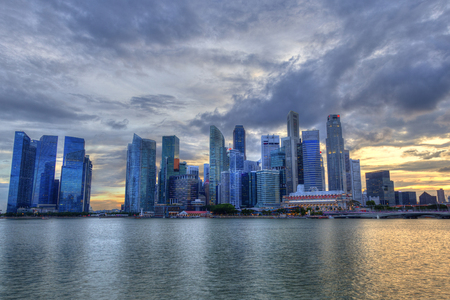 Singapore skyline at Marina Bay during sunset blue hour showing skyscrapers in downtown central financial business district.のeditorial素材