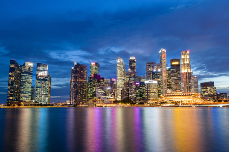 Singapore skyline at Marina Bay during sunset blue hour showing skyscrapers in downtown central financial business district.のeditorial素材