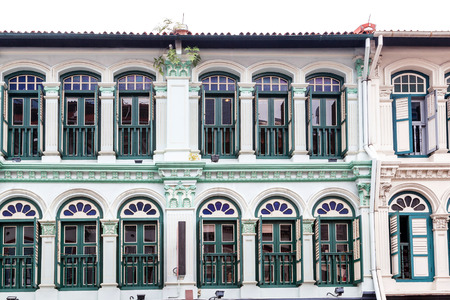 Rows of colonial style shop houses seen at Tanjong Pagar near Chinatown in Singapore. Traditionally, a shop house has a narrow frontage with a sheltered corridor at the front for pedestrians.のeditorial素材