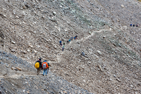 LAKE LOUISE, CANADA - SEPT 17, 2016: Hikers traverse the rocky trail of Mount Temple at Sentinel Pass in the Larch Valley near Lake Louise in Banff National Park, Alberta.のeditorial素材