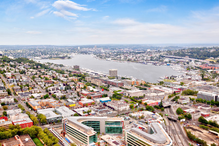 Seattle cityscape from aerial view showing suburban neighborhood surrounding Lake Union with residential houses, strip malls, small businesses and districts.の写真素材