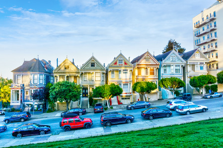 SAN FRANCISCO, APR 1, 2018: Late afternoon sun light up a row of colorful Victorian houses known as Painted Ladies across from Alamo Square. Built between 1892 and 1896, these houses are among the most iconic symbols of San Francisco.のeditorial素材