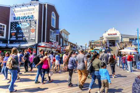 SAN FRANCISCO - APR 2, 2018: Visitors flock to Pier 39 at San Francisco's Fisherman's Wharf renowned for its varied attractions, shops and seafood.のeditorial素材