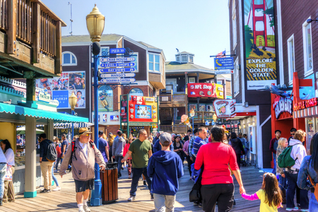 SAN FRANCISCO - APR 2, 2018: Visitors flock to Pier 39 at San Francisco's Fisherman's Wharf renowned for its varied attractions, shops and seafood.のeditorial素材