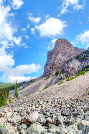 Boulders from a rock slide off Mount Babel in the background covered the hiking trail near Moraine Lake at Lake Louise near Banff National Park.の写真素材
