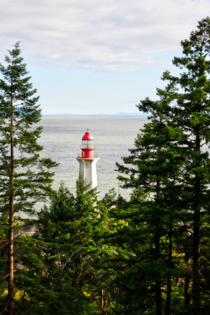 The historic Point Atkinson Lighthouse was built in 1914 overlooking Burrard Inlet in West Vancouver, Canada.の写真素材