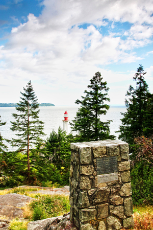 The historic Point Atkinson Lighthouse was built in 1914 overlooking Burrard Inlet in West Vancouver, Canada.の写真素材