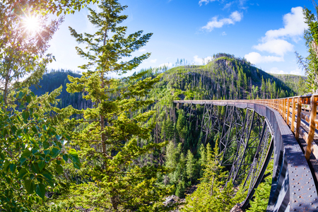 Originally one of 19 wooden railway trestle bridges built in the early 1900s in Myra Canyon, Kelowna, BC, it is now a public park with biking and hiking trails.のeditorial素材