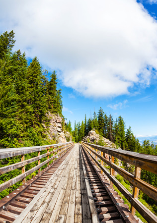 Originally one of 19 wooden railway trestle bridges built in the early 1900s in Myra Canyon, Kelowna, BC, it is now a public park with biking and hiking trails.のeditorial素材