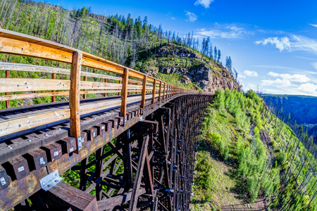 Originally one of 19 wooden railway trestle bridges built in the early 1900s in Myra Canyon, Kelowna, BC, it is now a public park with biking and hiking trails.のeditorial素材