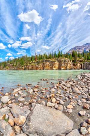 Athabasca River with stunning canyon walls at Athabasca Falls in Jasper National Park on the Icefields Parkway in Alberta, Canada, with Mount Kerkeslin in the background.の写真素材