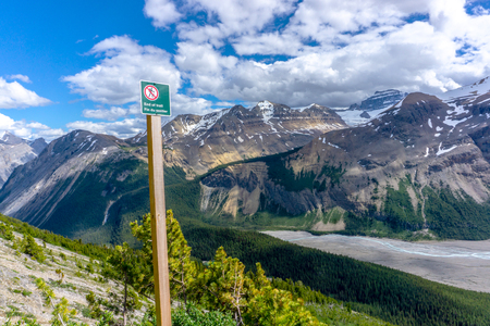 End of trail warning sign to hikers at the peak of Parker Ridge at Jasper National Park on the Icefields Parkway in the Canadian Rockies.の写真素材
