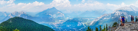 BANFF, CANADA - AUG 1, 2018: Visitors enjoying a panoramic view of the mountain range in the Canadian Rockies of Banff National Parkon on top of Sulphur Mountain at Sanson's Peak.のeditorial素材