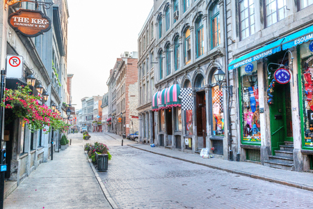 MONTREAL, CANADA - AUG 21, 2012: Shops along Rue Saint-Paul in the Old Montreal section of Montreal. It is the oldest street in Montreal, Quebec, Canada, famous for the many restaurants and unique shops.のeditorial素材