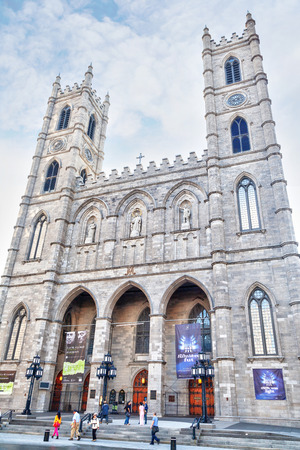 MONTREAL, CANADA - AUG 20, 2012: Historic Notre-Dame Basilica in Montreal, Quebec, Canada, a national historic site. The gothic-style Church was the largest in North America when it was built in 1829. Vertical orientation.のeditorial素材