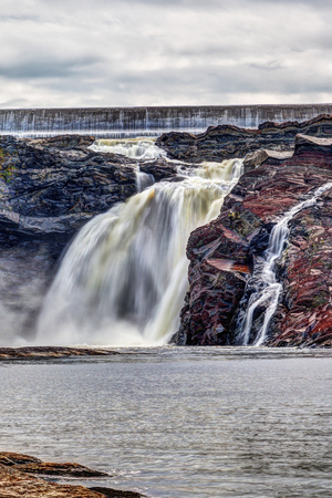 Chutes-de-la-Chaudiere or Chaudiere Falls are 35-meter high waterfalls in Levis, Quebec, that are the last and most impressive jolt of the ChaudiÃ¨re River flowing into the St Lawrence River. Archeological digs in the park have also uncovered evidence of the travels of nomadic groups about 8,000 years ago.の写真素材