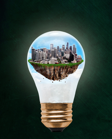 Floating city of Seattle inside light bulb with copy space. Concept of eco-friendly, energy efficient city and idea of environmental conservation in modern green city.の写真素材
