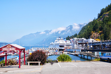 VANCOUVER - JUL 19, 2010 : Scenic Horseshoe Bay in Vancouver, Canada, with Sewell's Marina and the ferry terminal. The towering Coast Mountain and Howe Sound can be seen in the background.のeditorial素材