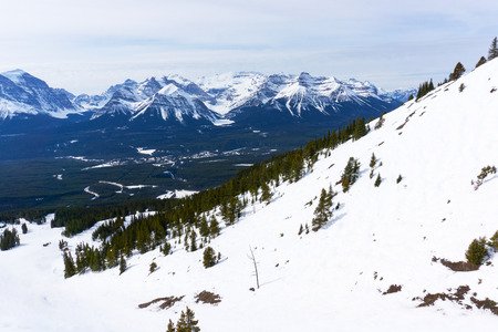 Snow-capped mountain landscape showing Mount Victoria glacier of the Canadian Rockies at Lake Louise near Banff National Park in Alberta, Canada.の写真素材