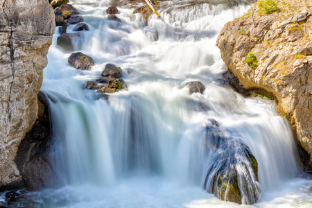 Firehole Falls on Firehole River in Yellowstone National Park, Wyoming, USA.