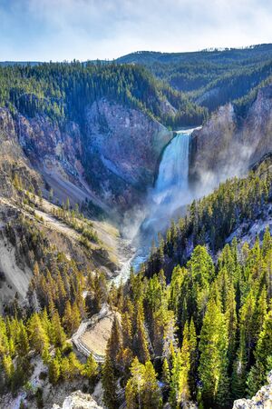 Lower Falls at Yellowstone National Park showing rushing waters of the waterfall from the Yellowstone River falling into the Grand Canyon of the Yellowstone.の写真素材