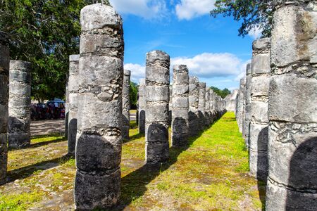 The Group of the Thousand Columns is a vast plaza that has the shape of an irregular quadrilateral connected to the ancient ruins of the Temple of the Warriors at the Mayan archaeological site of Chichen Itza, Mexico.の写真素材