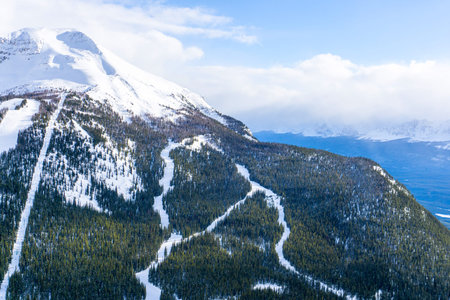 High angle view of ski trails on snow-capped mountain landscape in the Canadian Rockies at Lake...