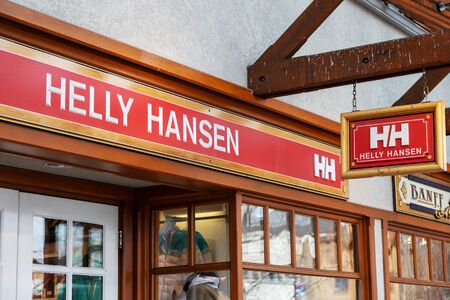 BANFF, CANADA - FEB 15, 2020 : Famous Norway-based Helly Hansen shop with its sign on busy Banff Avenue in Alberta, Canada. Helly Hansen is a ski and outdoor gear shop  specializing in high end outdoor apparelのeditorial素材