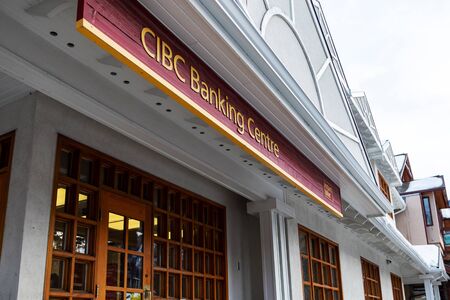 BANFF, CANADA - FEB 15, 2020 : The Canadian Imperial Bank of Commerce, commonly known as CIBC, with its sign on busy Banff Avenue in Alberta, Canada. CIBC is one of the Big Five banks in Canada.のeditorial素材