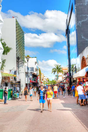 PLAYA DEL CARMEN, MEXICO - Dec. 26, 2019: Visitors enjoy shopping on famous 5th Avenue in the entertainment district of Playa del Carmen in the Yucatan peninsula of Caribbean Mexico in Cancun.のeditorial素材