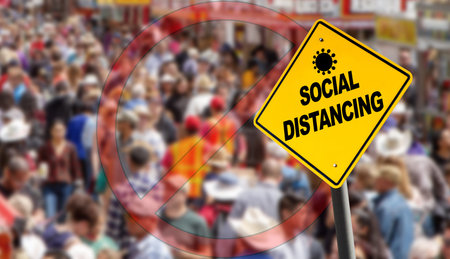 Social distancing warning sign with prohibition symbol over a packed crowd. Concept of staying...