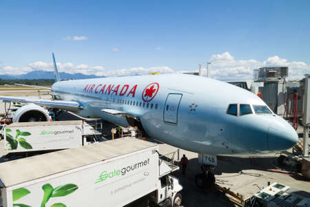 Vancouver, Canada - July 3, 2017: An Air Canada Airlines Boeing 777 plane being serviced on the tarmac of Vancouver International Airport.のeditorial素材