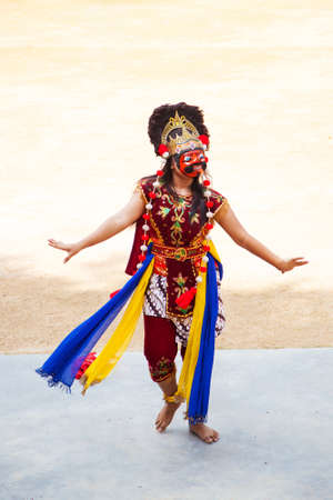 Bintan Island, Indonesia - July 23, 2017: Native Indonesian dancer wears a Topeng mask and ornate costume while performing traditional narratives of fabled kings, heroes and myths, accompanied by gamelan music.のeditorial素材