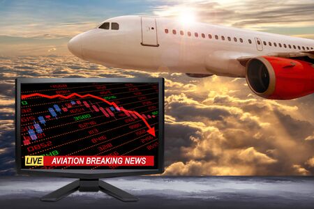 Live business breaking news update on TV screen with stock and financial indicators showing aviation and travel related industry in crisis due to Covid-19 coronavirus pandemic or other catastrophe.の写真素材